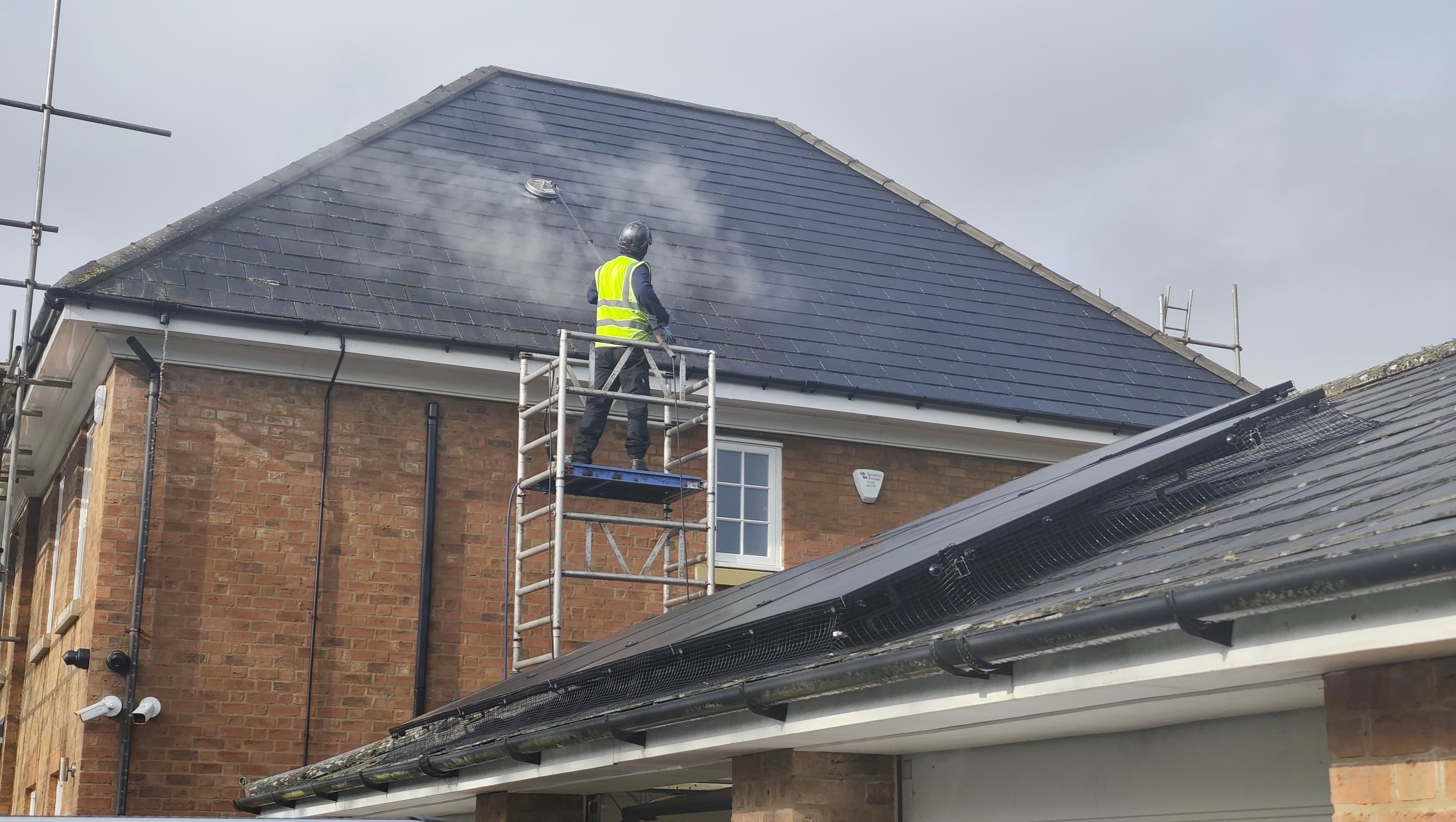 Keep It Clean team working safely on a roof
